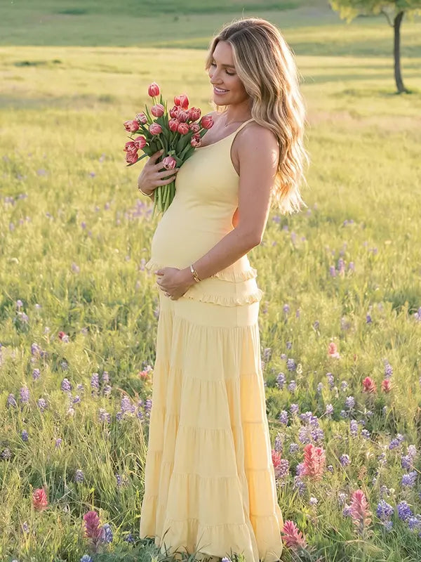 yellow maternity gown backless flowy tiered skirt summer photoshoot pregnancy dress
