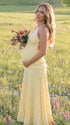 yellow maternity gown backless flowy tiered skirt summer photoshoot pregnancy dress