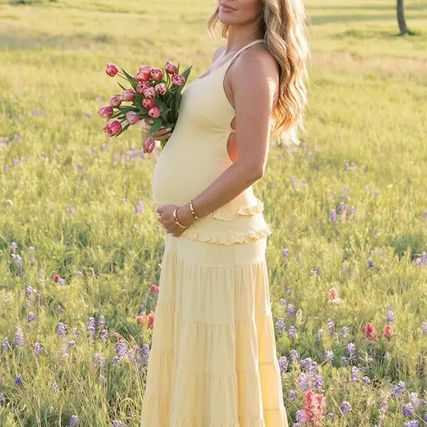 yellow maternity gown backless flowy tiered skirt summer photoshoot pregnancy dress