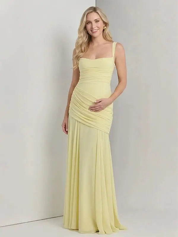 Butter Yellow ruched corset maternity maxi dress with adjustable straps, made from high-stretch milk silk fabric, elegant backless baby shower gown for maternity photoshoot and special occasions.