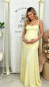 Butter Yellow ruched corset maternity maxi dress with adjustable straps, made from high-stretch milk silk fabric, elegant backless baby shower gown for maternity photoshoot and special occasions.