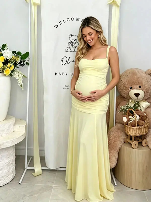Butter Yellow ruched corset maternity maxi dress with adjustable straps, made from high-stretch milk silk fabric, elegant backless baby shower gown for maternity photoshoot and special occasions.