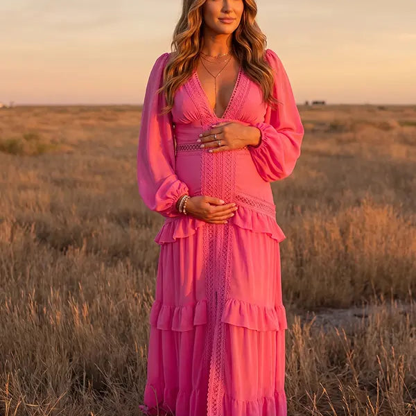 hot pink lace trim maternity maxi dress with long sleeves and flowing tiered skirt
