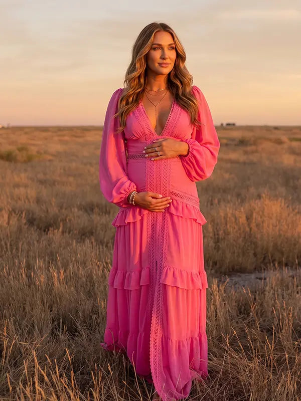 hot pink lace trim maternity maxi dress with long sleeves and flowing tiered skirt