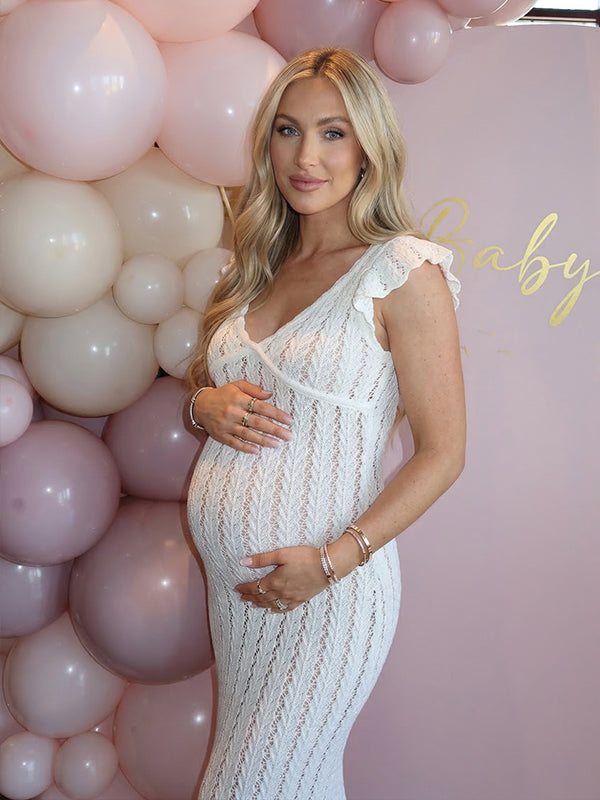 Side view of White Crochet Ruffle Flutter Sleeve Maternity Maxi Dress