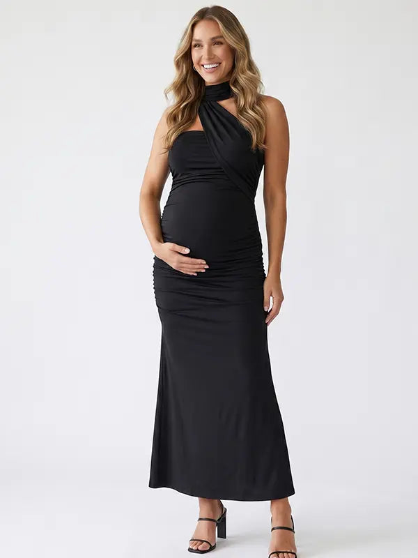 black halter maternity maxi dress with ruched bodycon silhouette and cross neck detail