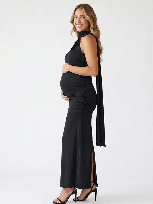 black halter maternity maxi dress with ruched bodycon silhouette and cross neck detail