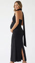 black halter maternity maxi dress with ruched bodycon silhouette and cross neck detail
