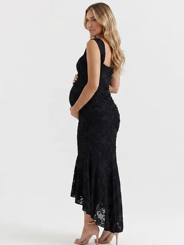 black jacquard maternity midi dress with corset bodice and high low hem