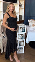 black jacquard maternity midi dress with corset bodice and high low hem