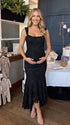 black jacquard maternity midi dress with corset bodice and high low hem