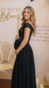 A black lace off shoulder maternity maxi dress with a flowing chiffon skirt for baby shower, maternity photoshoot, gender reveal and formal pregnancy occasions.