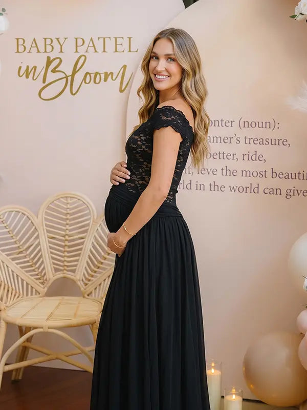 A black lace off shoulder maternity maxi dress with a flowing chiffon skirt for baby shower, maternity photoshoot, gender reveal and formal pregnancy occasions.