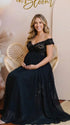 A black lace off shoulder maternity maxi dress with a flowing chiffon skirt for baby shower, maternity photoshoot, gender reveal and formal pregnancy occasions.