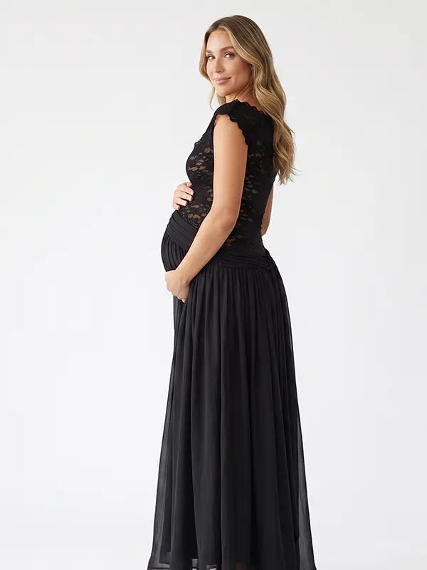 A black lace off shoulder maternity maxi dress with a flowing chiffon skirt for baby shower, maternity photoshoot, gender reveal and formal pregnancy occasions.