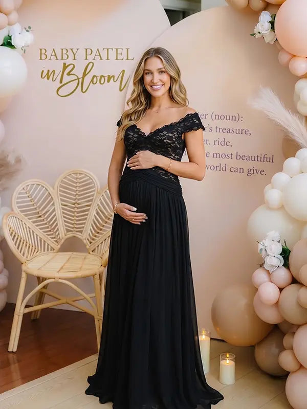 A black lace off shoulder maternity maxi dress with a flowing chiffon skirt for baby shower, maternity photoshoot, gender reveal and formal pregnancy occasions.