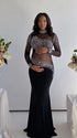 Pregnant woman wearing a black long sleeve rhinestone illusion mesh maternity mermaid maxi dress for luxury maternity photoshoots, baby showers, pregnancy announcements, editorial portraits, and formal events.