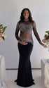 Pregnant woman wearing a black long sleeve rhinestone illusion mesh maternity mermaid maxi dress for luxury maternity photoshoots, baby showers, pregnancy announcements, editorial portraits, and formal events.
