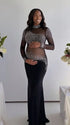 Pregnant woman wearing a black long sleeve rhinestone illusion mesh maternity mermaid maxi dress for luxury maternity photoshoots, baby showers, pregnancy announcements, editorial portraits, and formal events.