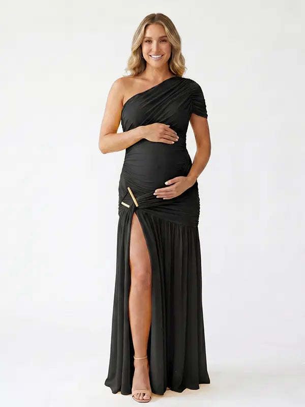 Black one shoulder maternity gown with ruched silhouette and high slit for elegant pregnancy photoshoots