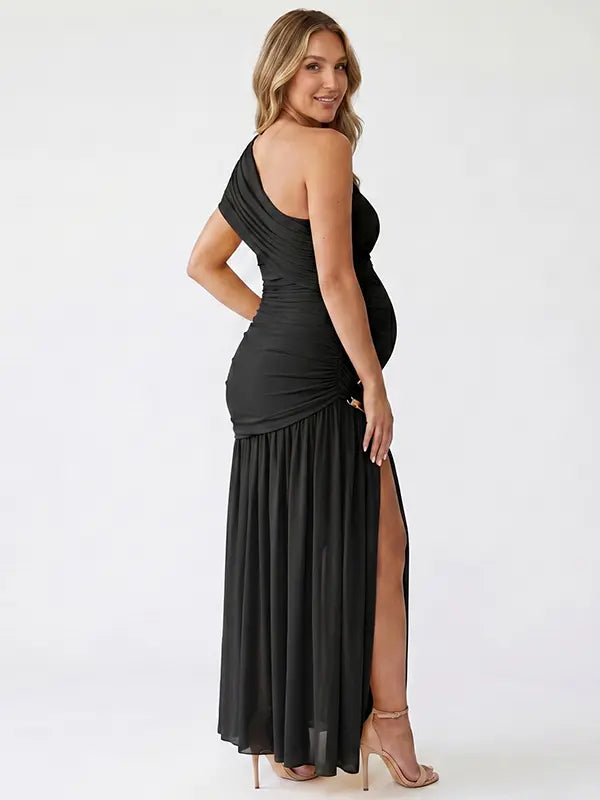 Black one shoulder maternity gown with ruched silhouette and high slit for elegant pregnancy photoshoots