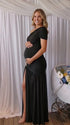 Black one shoulder maternity gown with ruched silhouette and high slit for elegant pregnancy photoshoots