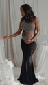 A black rhinestone illusion mesh maternity mermaid maxi dress for luxury maternity photoshoots, baby showers, editorial portraits, and formal pregnancy events.