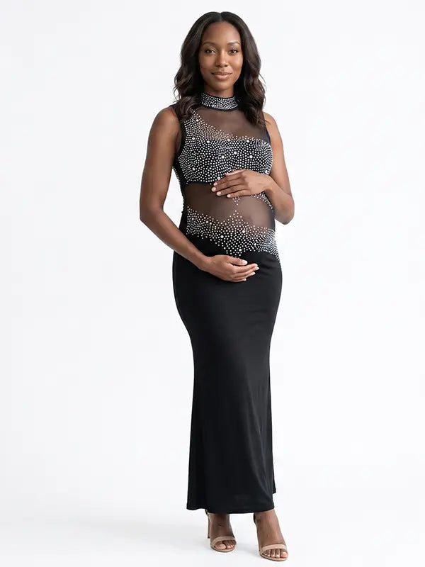 A black rhinestone illusion mesh maternity mermaid maxi dress for luxury maternity photoshoots, baby showers, editorial portraits, and formal pregnancy events.