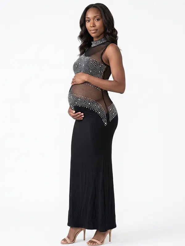 A black rhinestone illusion mesh maternity mermaid maxi dress for luxury maternity photoshoots, baby showers, editorial portraits, and formal pregnancy events.