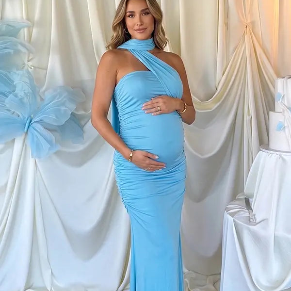 lake blue halter maternity maxi dress with ruched bodycon silhouette and cross neck detail