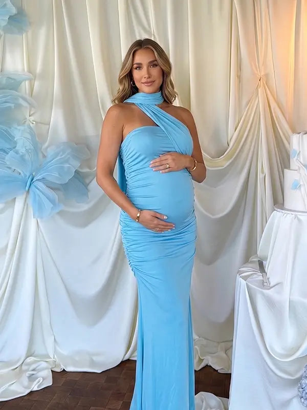 lake blue halter maternity maxi dress with ruched bodycon silhouette and cross neck detail
