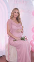 blush pink mesh maternity gown with draped cowl neckline and cascading ruffle sleeves