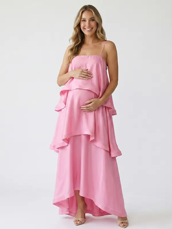 blush pink tiered ruffle maternity maxi dress with flowy layers and spaghetti straps