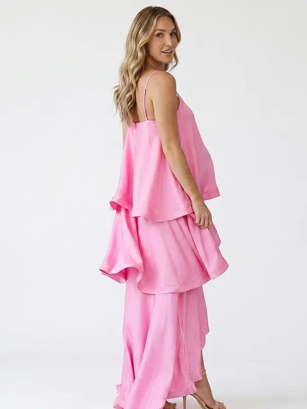 blush pink tiered ruffle maternity maxi dress with flowy layers and spaghetti straps