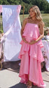 blush pink tiered ruffle maternity maxi dress with flowy layers and spaghetti straps
