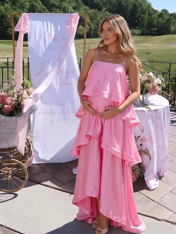 blush pink tiered ruffle maternity maxi dress with flowy layers and spaghetti straps