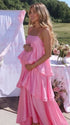 blush pink tiered ruffle maternity maxi dress with flowy layers and spaghetti straps