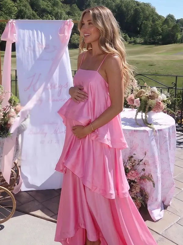blush pink tiered ruffle maternity maxi dress with flowy layers and spaghetti straps