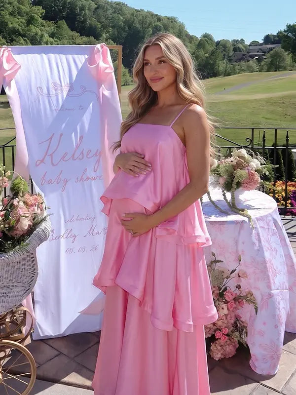 blush pink tiered ruffle maternity maxi dress with flowy layers and spaghetti straps