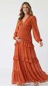 burnt orange lace trim maternity maxi dress with long sleeves and flowing tiered skirt