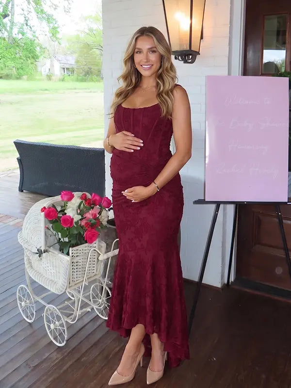 burgundy jacquard maternity midi dress with corset bodice and high low hem