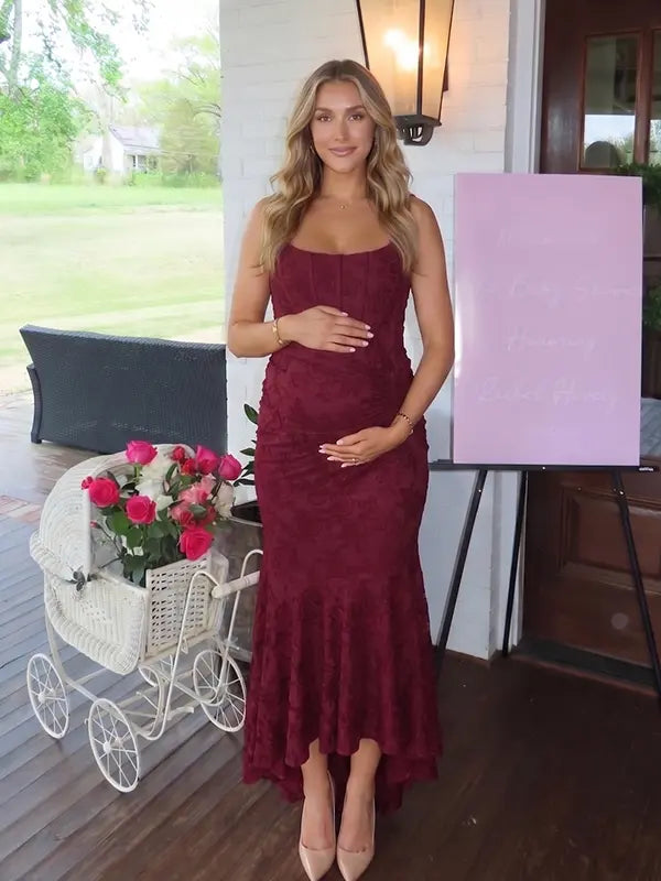 burgundy jacquard maternity midi dress with corset bodice and high low hem
