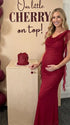 burgundy mesh maternity gown with draped neckline and cascading ruffle details