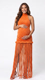 Burnt orange fringe halter maternity maxi dress with tassel hem, bodycon pregnancy gown for fall baby showers, pumpkin patch maternity photoshoots, harvest celebrations, and autumn pregnancy portraits.
