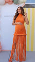 Burnt orange fringe halter maternity maxi dress with tassel hem, bodycon pregnancy gown for fall baby showers, pumpkin patch maternity photoshoots, harvest celebrations, and autumn pregnancy portraits.