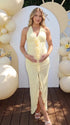 butter yellow floral halter maternity dress with ruched silhouette and front slit for baby shower