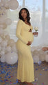 butter yellow lace maternity gown with long sleeves twist front neckline and mermaid silhouette