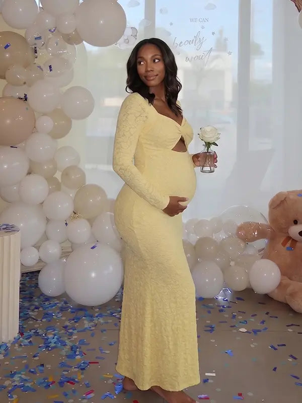 butter yellow lace maternity gown with long sleeves twist front neckline and mermaid silhouette