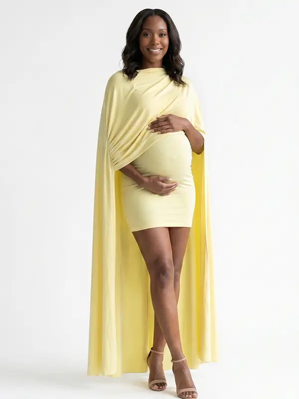 butter yellow maternity cape dress with bodycon mini silhouette and dramatic flowing drape