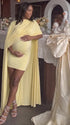 butter yellow maternity cape dress with bodycon mini silhouette and dramatic flowing drape